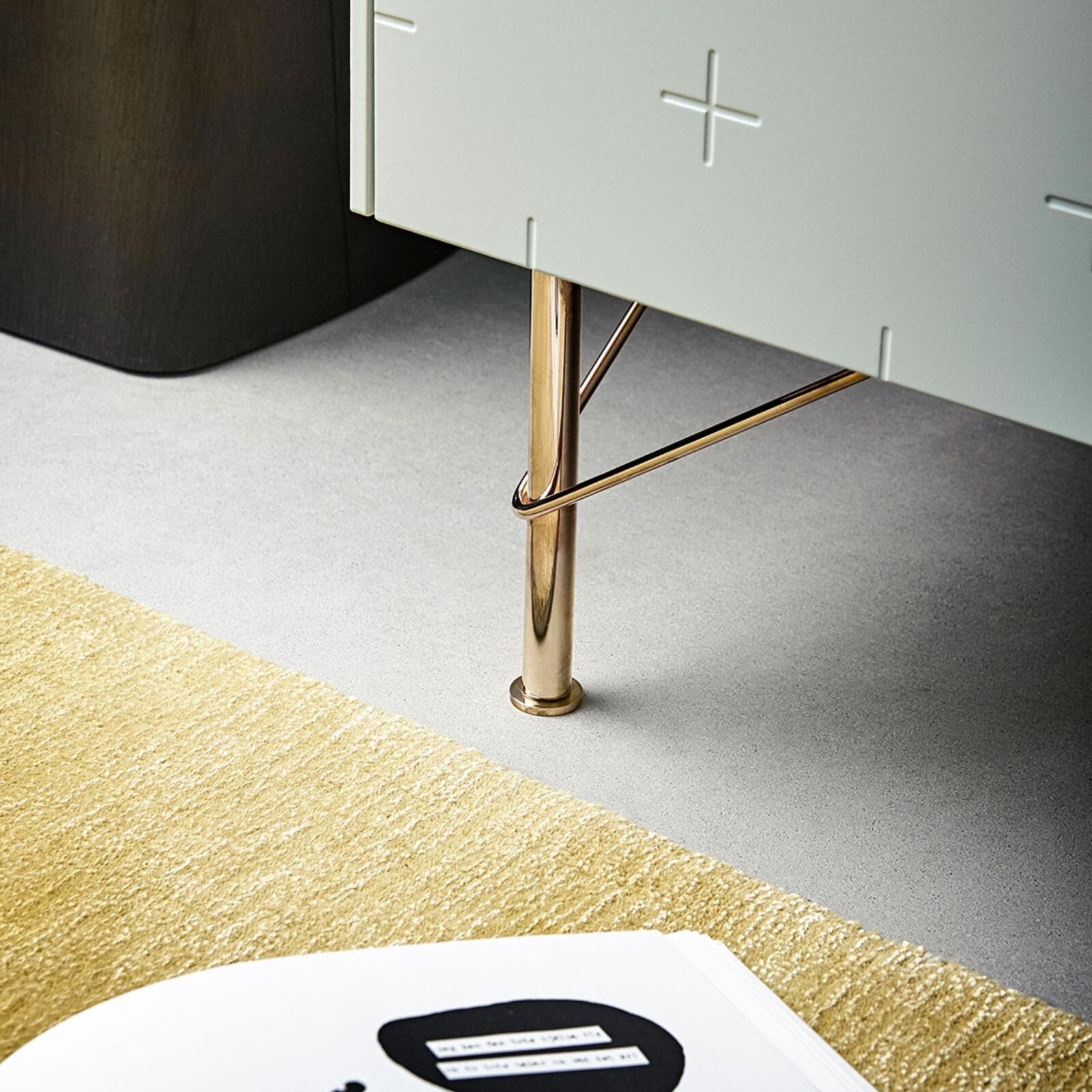 Furniture leg in brass on a frame from Ikea with sage green cabinet fronts from Superfront