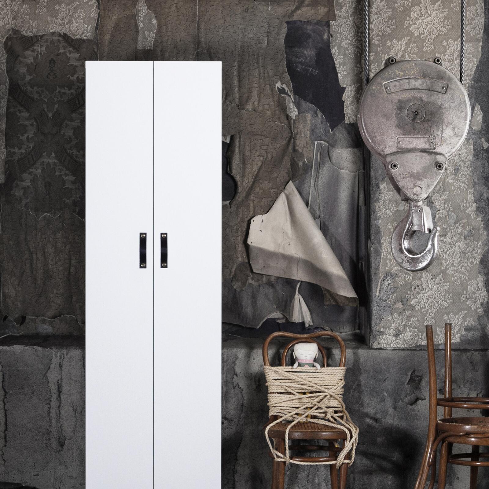 Sleek white cabinet with leather handles from Superfront