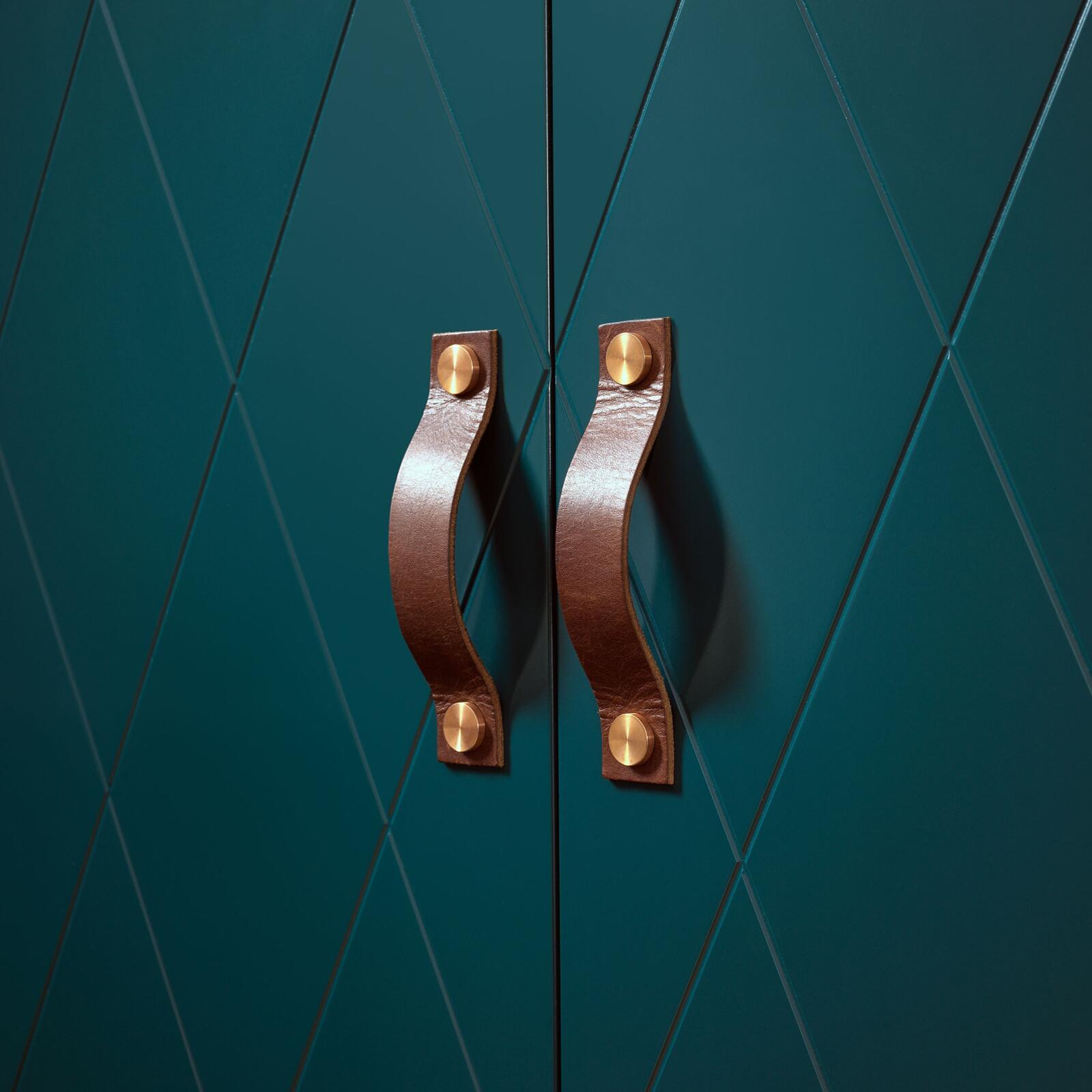 Brown leather handles from Superfront, mounted on bottle green wardrobe fronts