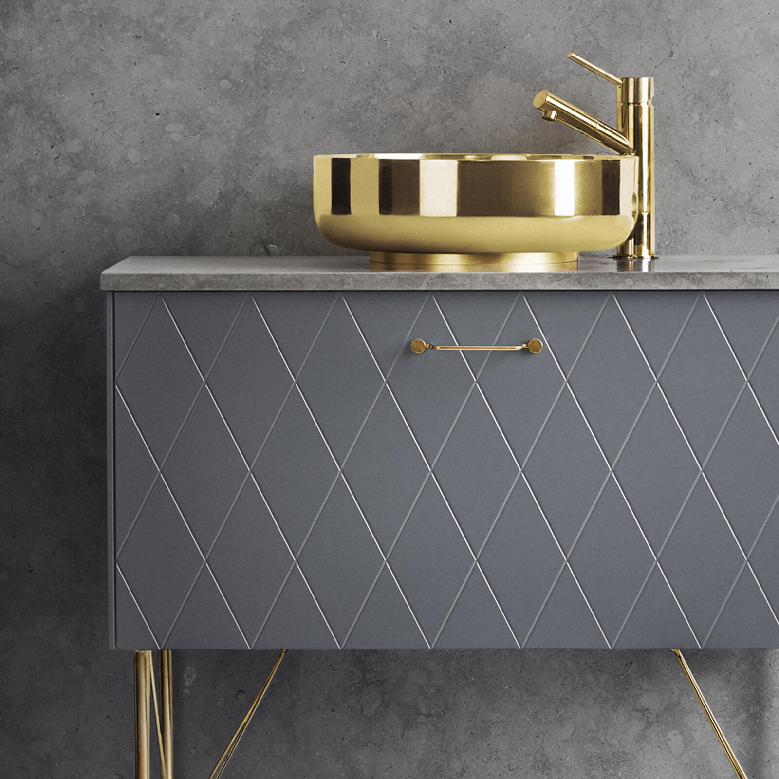 Handle in solid brass on a grey vanity unit